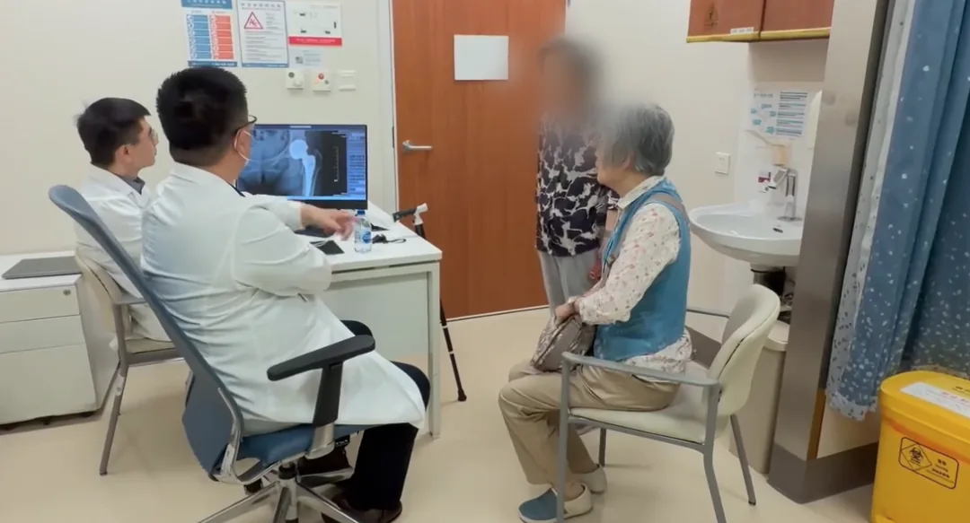 Jiahui physicians reviewing hip X-rays with an elderly patient during a consultation
