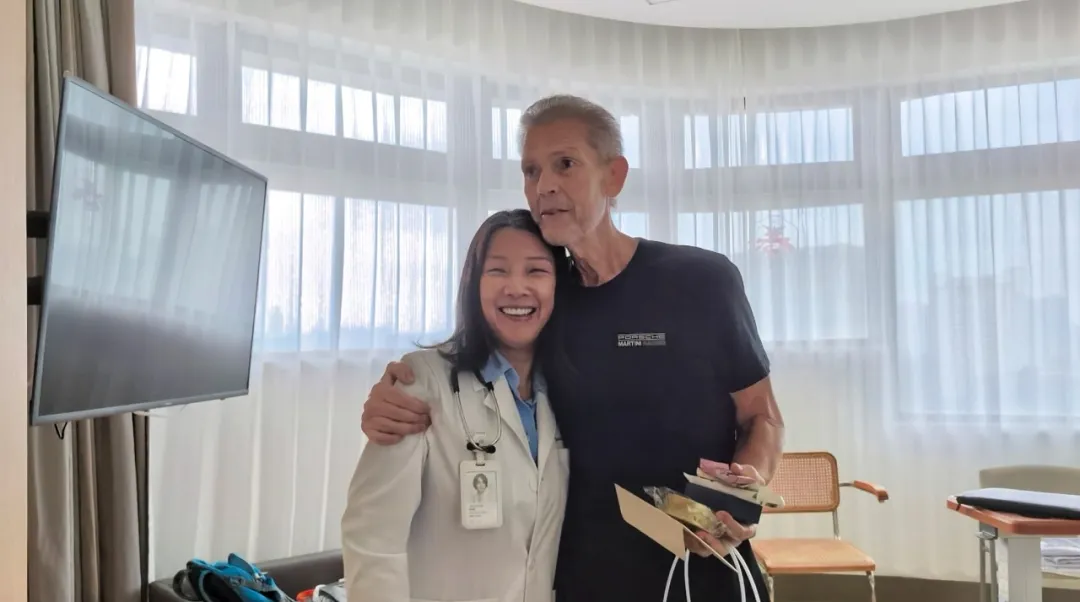 Dr. Xuan Linli embraces Josh, the first foreign patient to complete solid tumor CAR-T (CT041) at Jiahui International Cancer Center