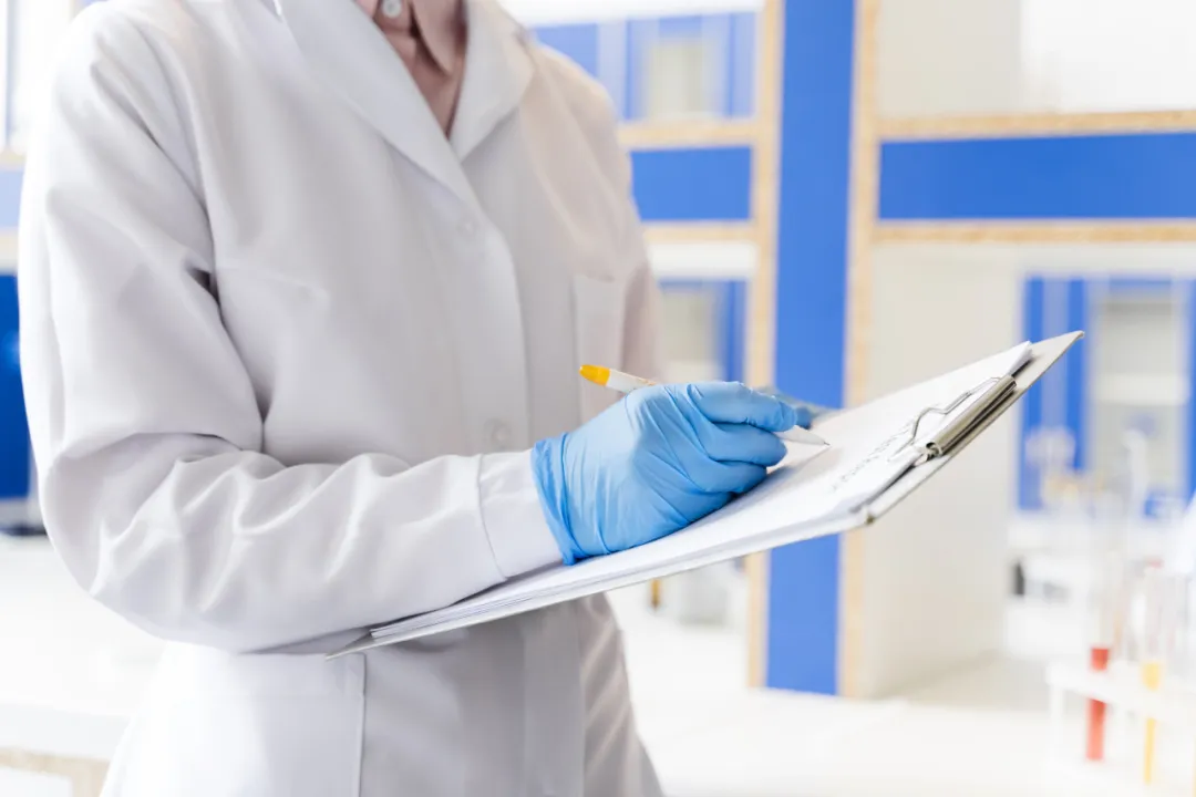 Laboratory professional reviewing oncology treatment data, representing Tarlatamab now available at Jiahui